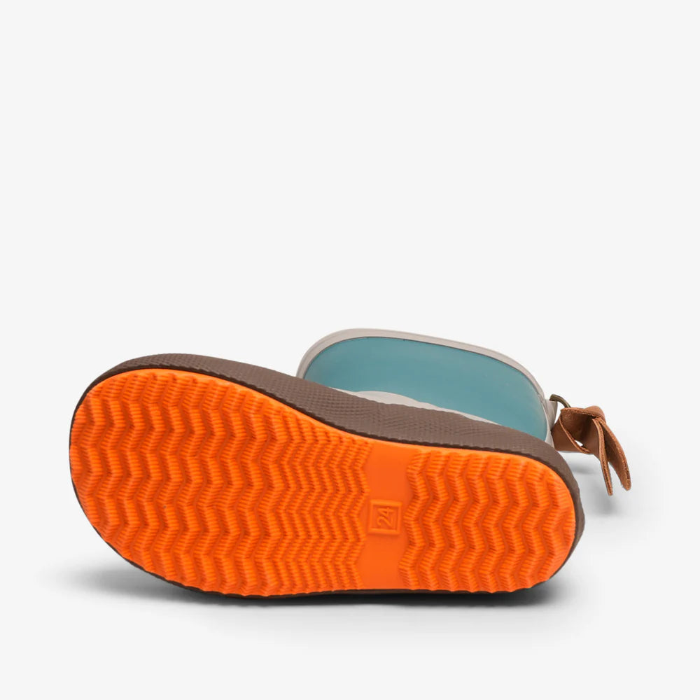 Close-up of a shoe sole with orange tread