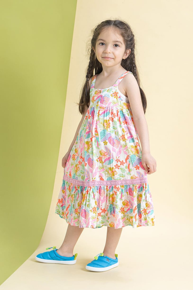 a young girl wearing A pair of blue casual kids barefoot shoes.